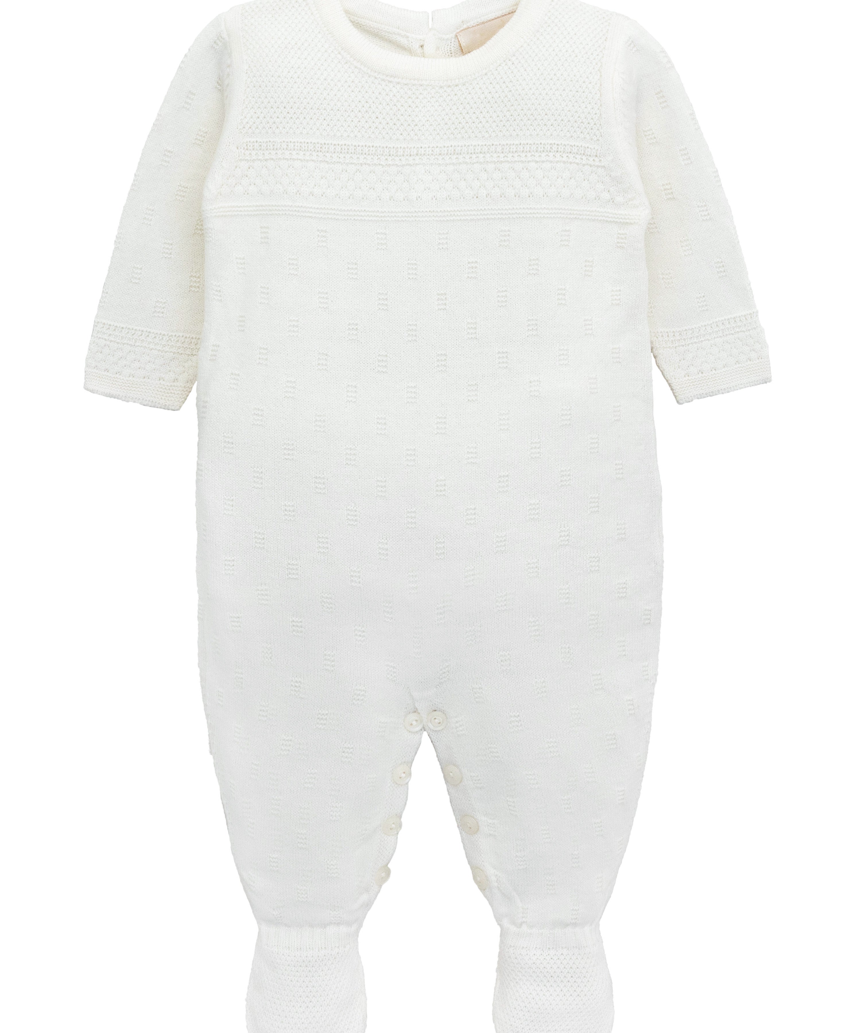 A knit footed jumpsuit or onesie with geometric patterns; cozy baby boy clothes, perfect for baby registry and Christmas gift ideas 