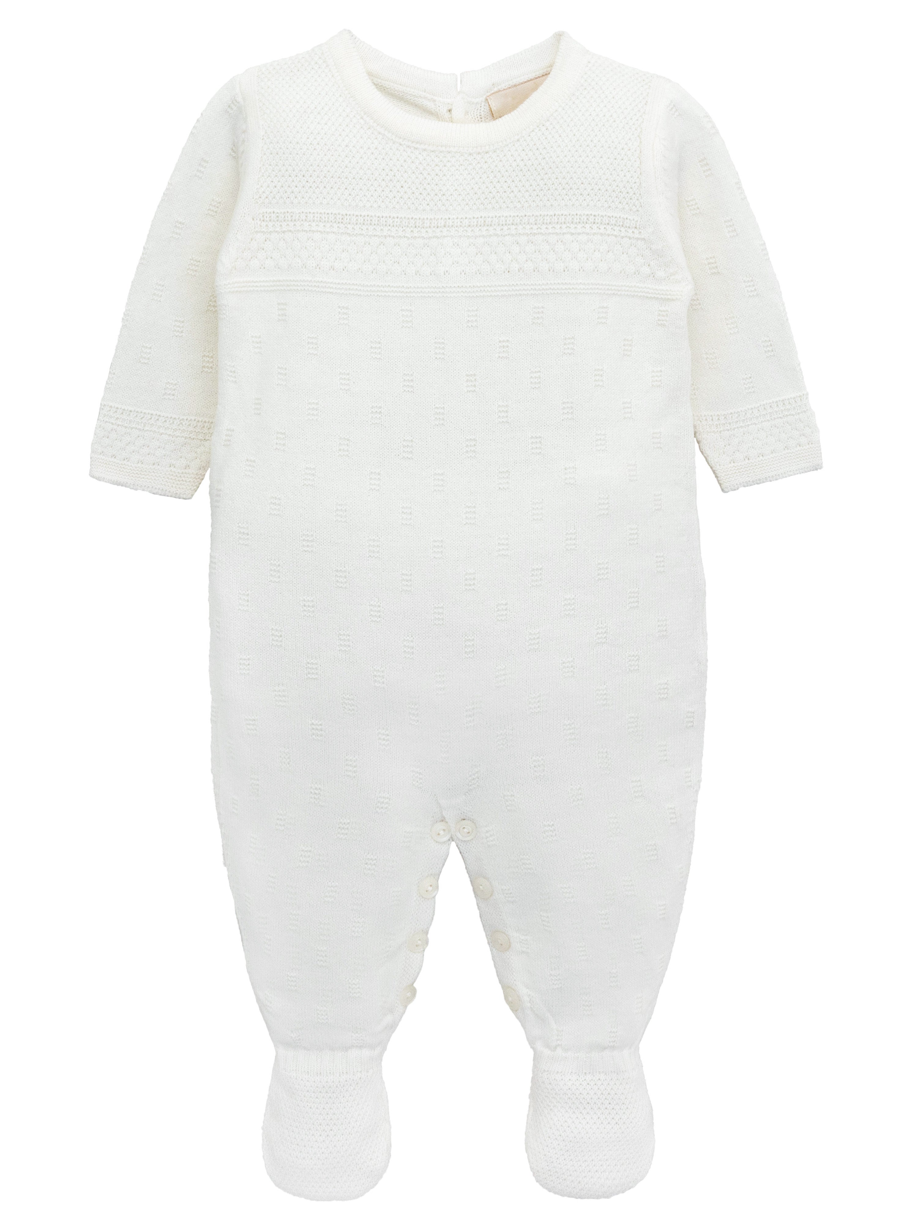 A knit footed jumpsuit or onesie with geometric patterns; cozy baby boy clothes, perfect for baby registry and Christmas gift ideas 