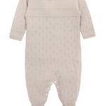 A knit footed jumpsuit or onesie with geometric patterns; cozy baby girl clothes, perfect for baby registry and Christmas gift ideas 