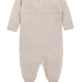 A knit footed jumpsuit or onesie with geometric patterns; cozy baby girl clothes, perfect for baby registry and Christmas gift ideas 