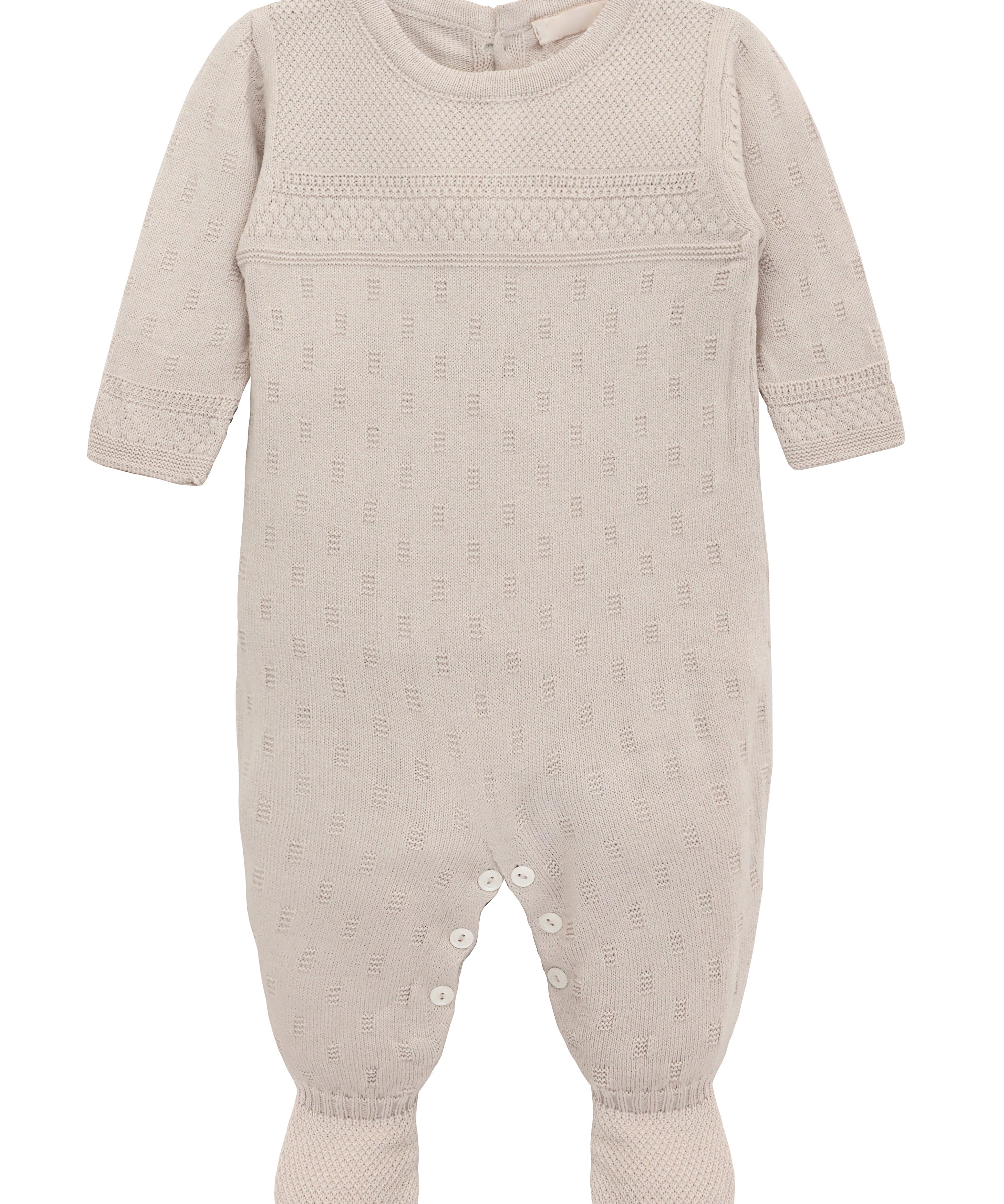 A knit footed jumpsuit or onesie with geometric patterns; cozy baby girl clothes, perfect for baby registry and Christmas gift ideas 