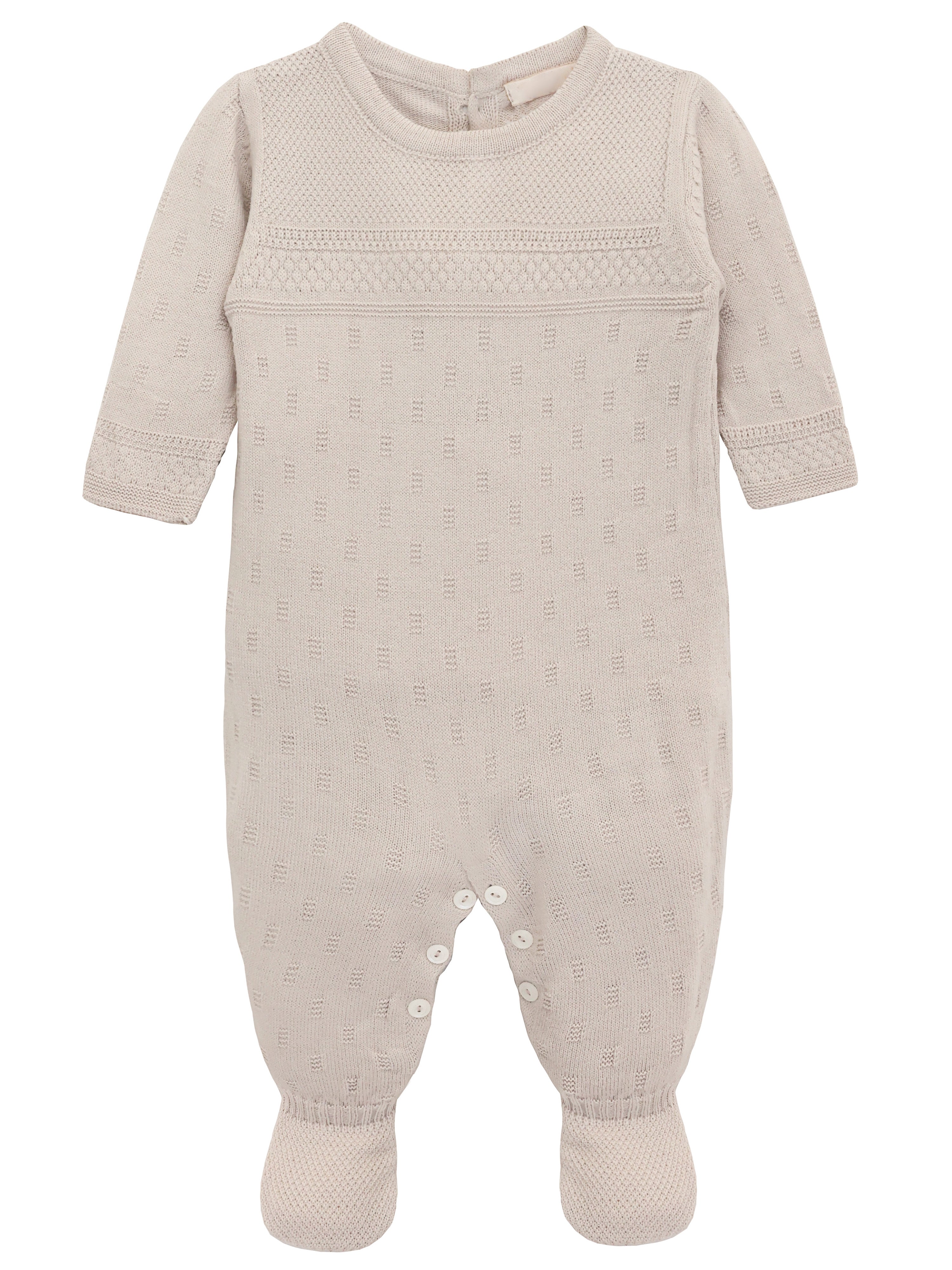 A knit footed jumpsuit or onesie with geometric patterns; cozy baby girl clothes, perfect for baby registry and Christmas gift ideas 